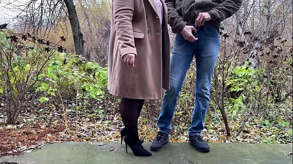 StepMother-in-law in leather skirt and heels holds son-in-law's dick while he pees