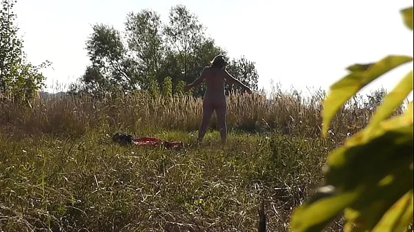 Nudist beach. Public nudity. Naked in public. Random guy watches naked sexy blonde MILF Frina undressed and sunbathing on shore of lake without panties and bra. Big natural tits Milf. Ass Milf. Butt Milf. Outdoor. Outside. Nudists. Naturists. Doggystyle