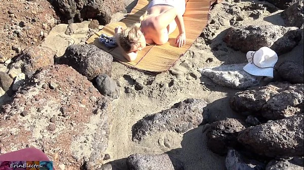 Peeping voyeur fucks blonde MILF on the beach