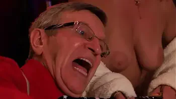 Clothed man and naked women