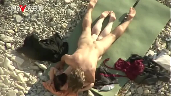 Beach Voyeur. Is fresh sperm good as a sunblock cream?