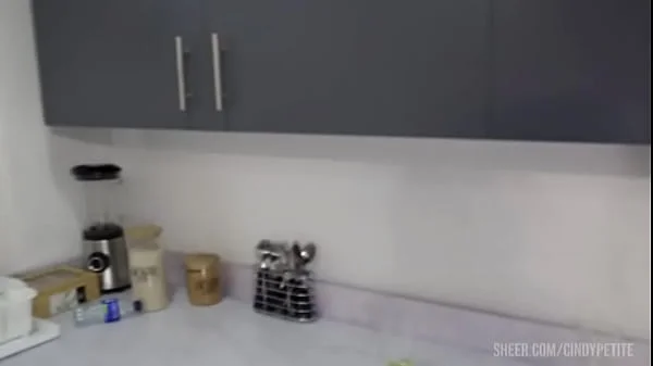 He fucks his coworker while his wife prepares lunch for them.