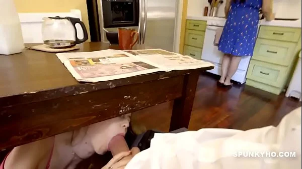 step Daughter sneaks under the table to suck daddy's cock