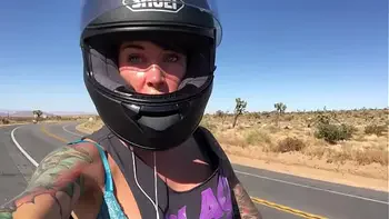 felicity feline riding on aprilia tuono motorcycle