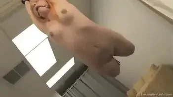 teen is ballgagged, hogtied and suspended from ceiling like decoration