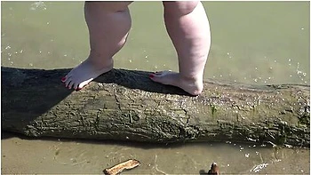 Fat Bare Legs With Red Pedicure Walk Along The Bank Of The River, Fetish