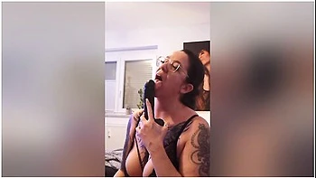 Tattooed Big Boobed Brunette With Glasses Teases With Her Tampoo And Favorite Big Dildo