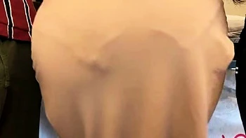 Brunette seductress working her big boobs and hot ass