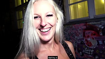 A girl with long blond hair is doing a blowjob with her boyfriend