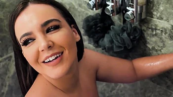 Brunette woman has sex with her boyfriend in the bathroom, showcasing big tits.