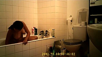 Brunette uses the toilet and takes a shower