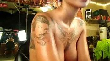 Tattooed Chinese Filipina babe oils solo pussy play