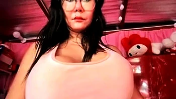 Busty Asian amateur flaunts huge tits on cam