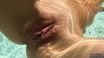 Sweet teen Rosalinda masturbates by the pool, shaved pussy on display