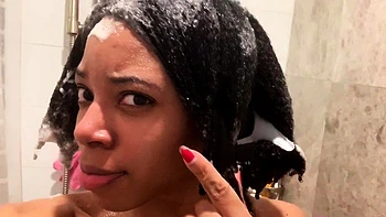 Ebony babe with big tits takes shower solo