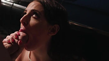 Angela White gets her big natural tits covered with cum in a gangbang scene.